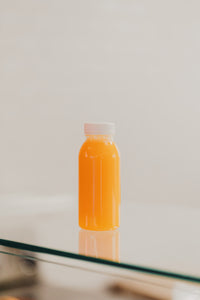 Friskpresset appelsin, gulerod og ingefærjuice på flaske 0.25L